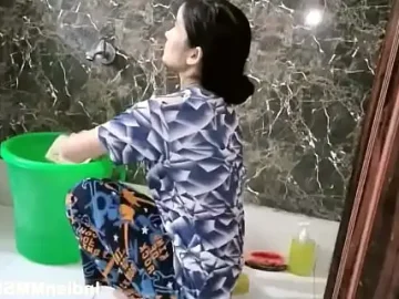 indian wife in bathroom washing and taking shower 1734240479
